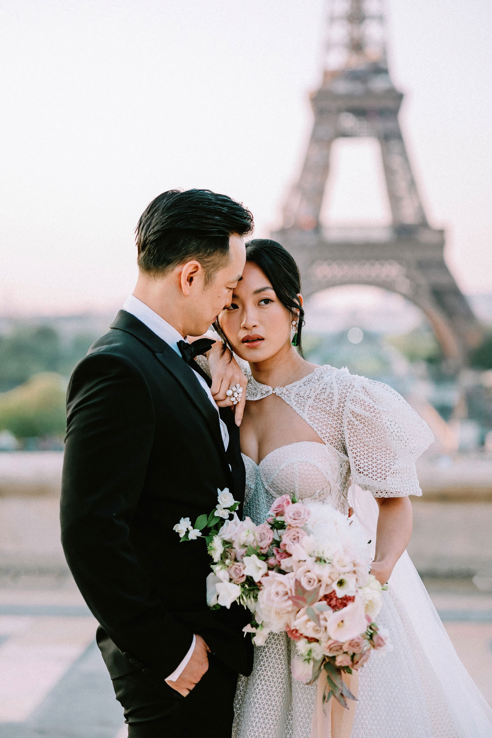 Couple posing at Trocadero for a Paris PreWedding Photographer